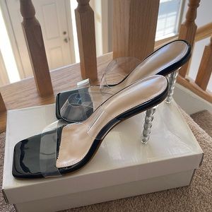 Smooth and sexy black gray and tan size 8 high heel shoe.